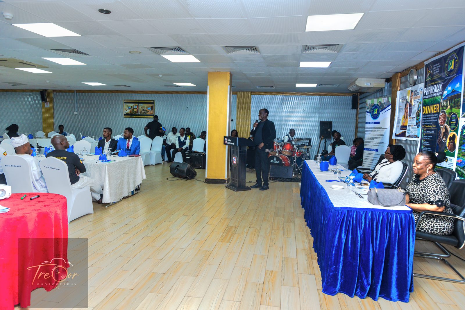 Guests seated at the Fundraising Dinner in the hall at Hotel Africana, Kampala
