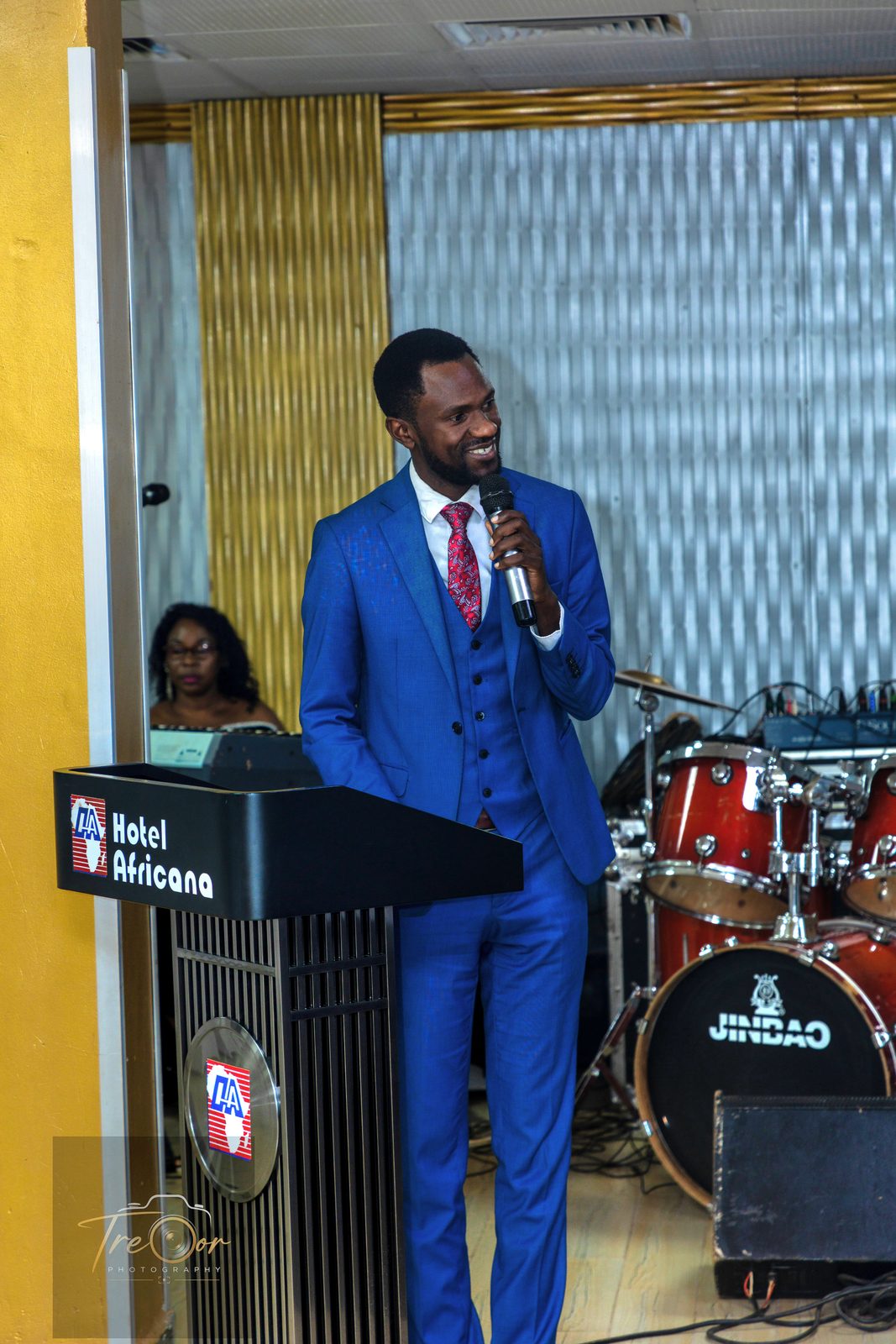 The master of ceremonies at the Hotel Africana podium