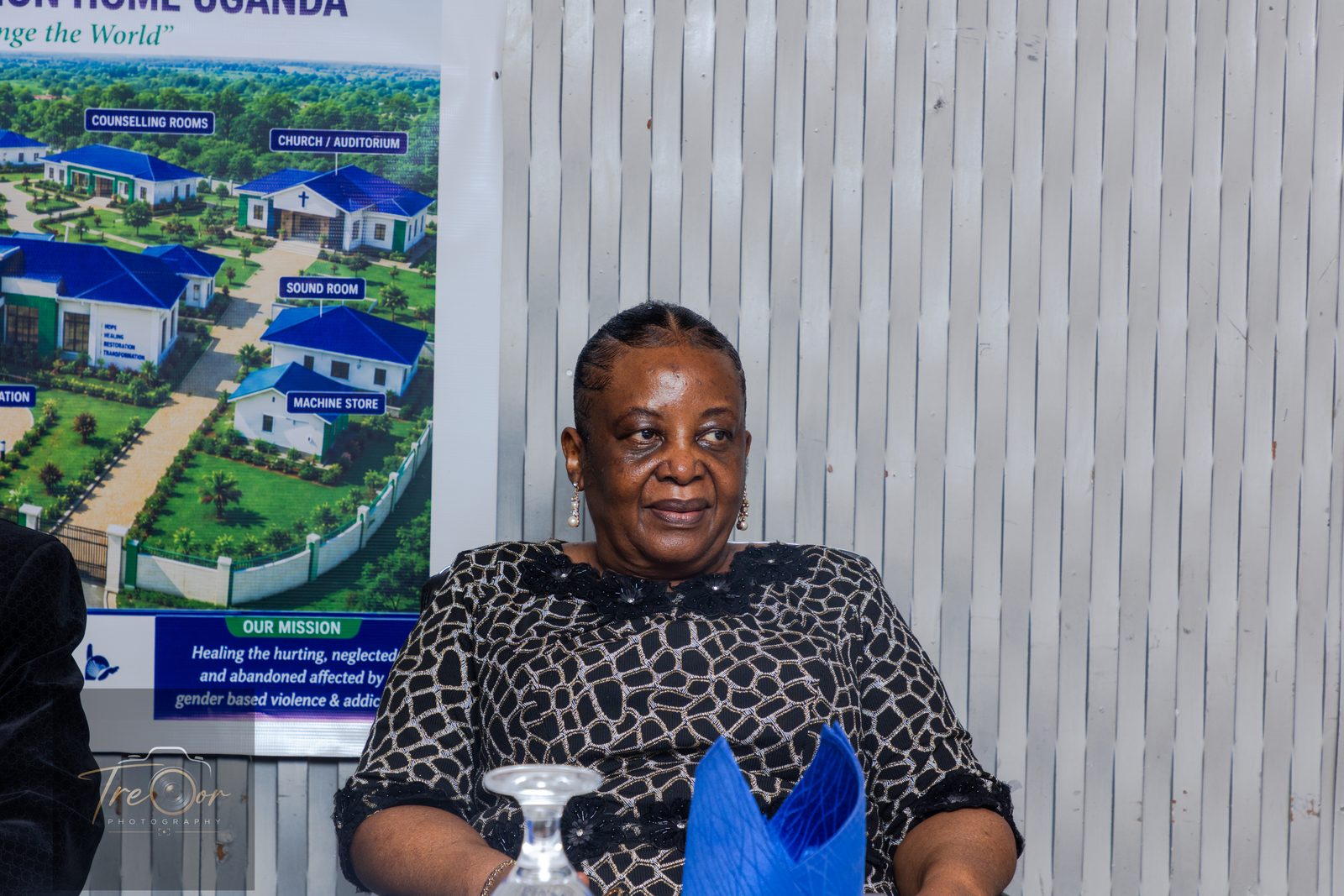 A guest at the head table beside the PhiphyMak mission banner