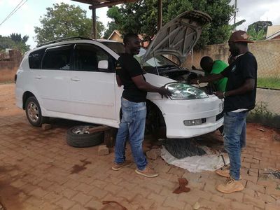 Trainees working on a vehicle during mechanical training